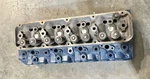 Ford Tractor 4 Cylinder Diesel Head Complete D9NN6090BA Used / Rebuilt. Fixed Price $1850.00.