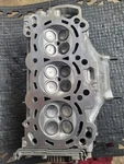 Engine Cylinder Head-remanufactured; Complete With Valves And Springs. Fixed Price $700.00.