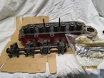 Early Mgb Cylinder Head 12H906 (with Rocker Arm Shaft Assembly And Push Rods). Fixed Price $200.00.